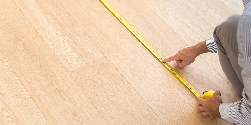 Architect measureing floor