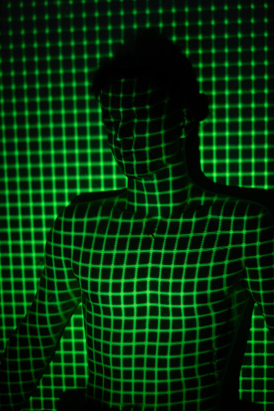 green grid of light on young man